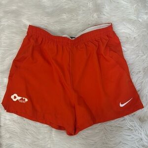 Nike orange athletic team shorts Size small recycled, polyester